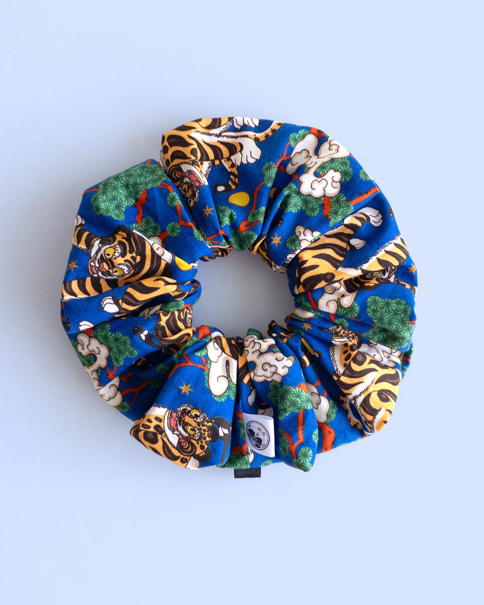 Hojakdo Korean scrunchie with tiger and magpie design on blue cotton fabric