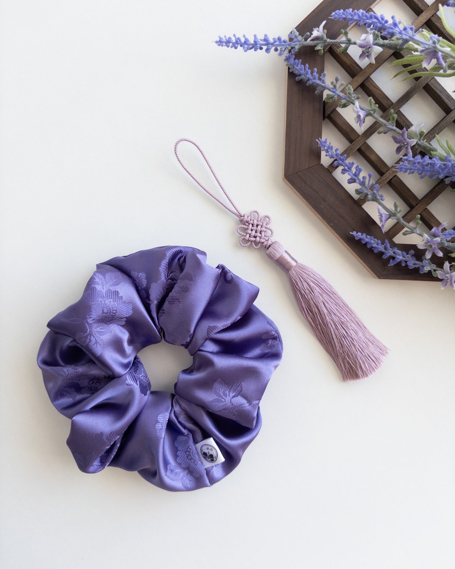 Purple hanbok scrunchie with Norigae(tassel) on a white background