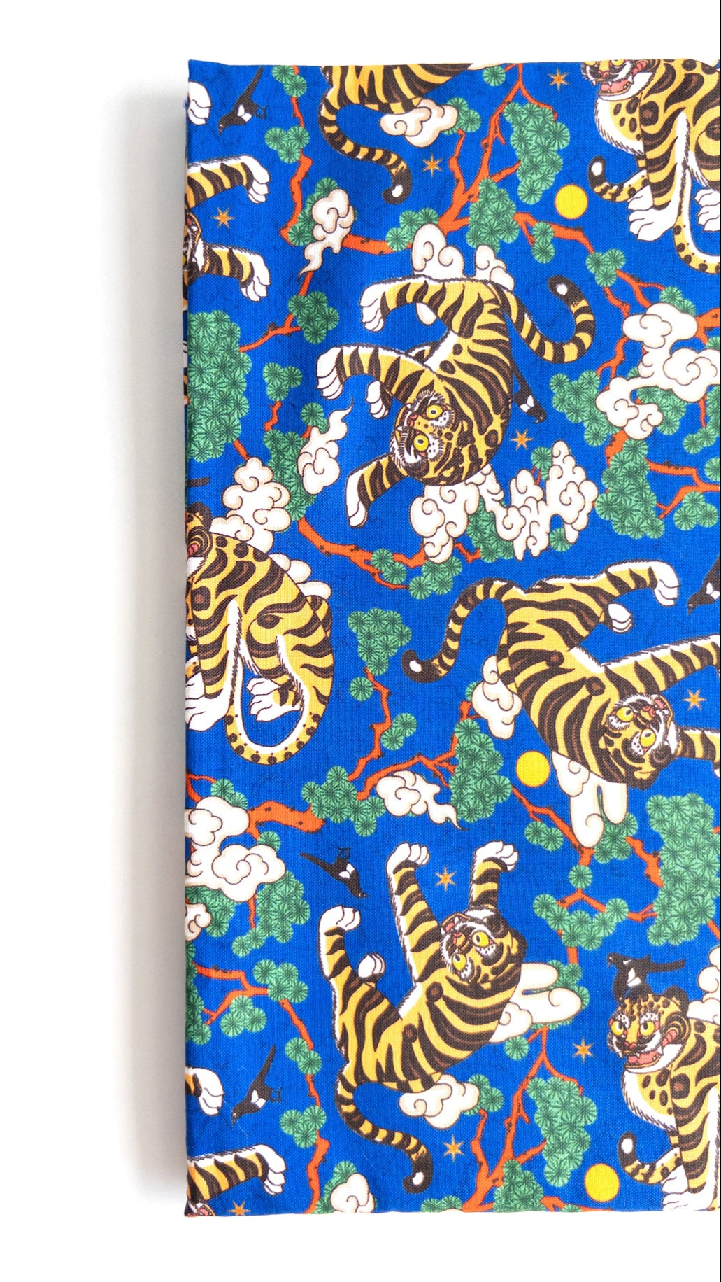A traditional Korean Hojakdo design featuring a tiger and magpie on blue cotton fabric.
